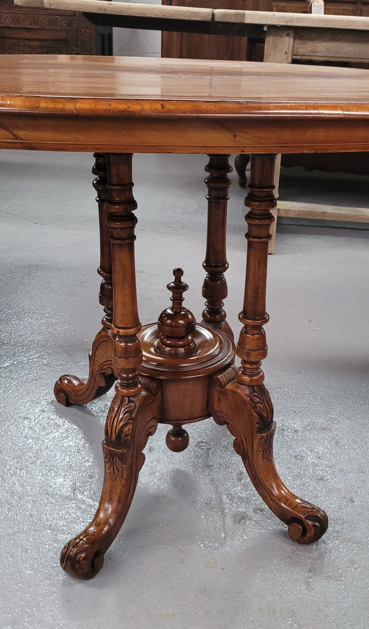 Victorian Walnut oval beautifully inlaid occasional table with bird cage undercarriage. It is in good original detailed condition and it has been sourced locally.