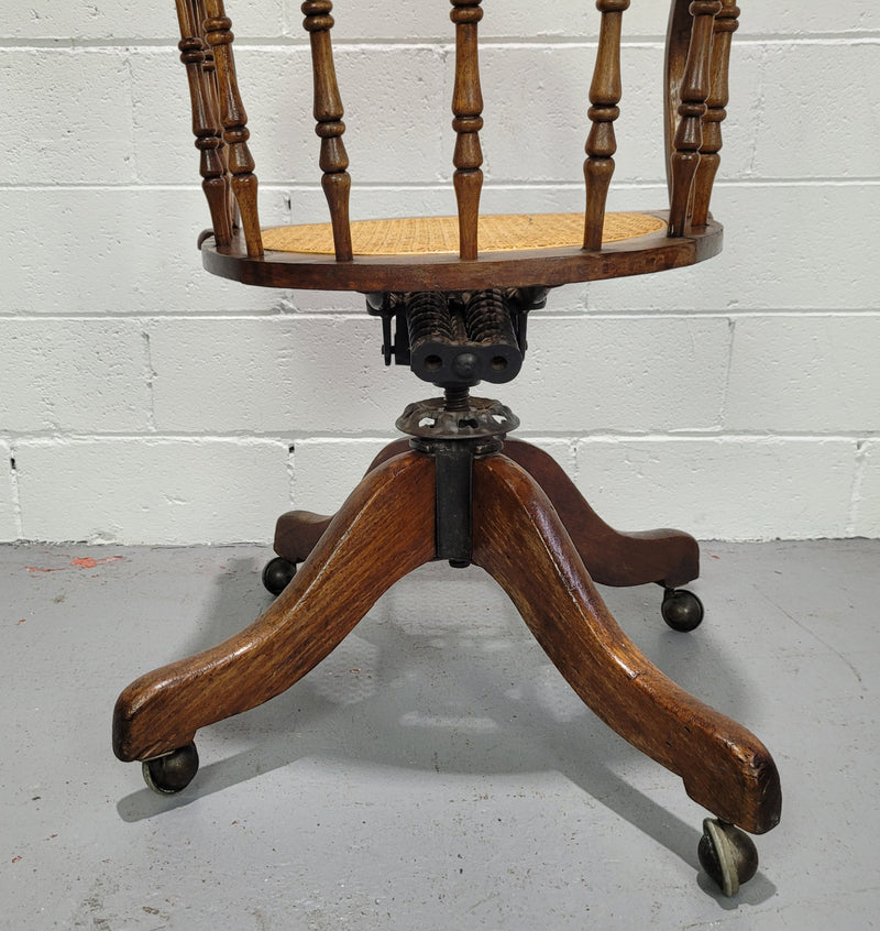 Elm Bentwood and cane swivel desk chair. In good original detailed condition and is comfortable to sit in.