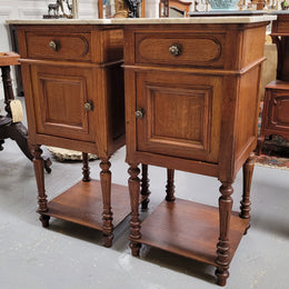 Antique French Oak Henry II white marble top bedside cabinets. They have one drawer and cupboard a long with an open shelf at the bottom. Sourced from France and in good original detailed condition.