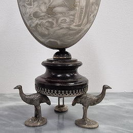 Superbly carved Emu egg on a emu metal and ebony base. It depicts an Aboriginal hunting scene and dreaming's. It is in good original condition, please view photos as they help form part of the description.