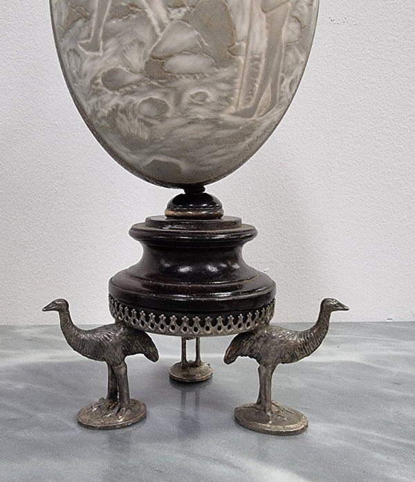 Superbly carved Emu egg on a emu metal and ebony base. It depicts an Aboriginal hunting scene and dreaming's. It is in good original condition, please view photos as they help form part of the description.
