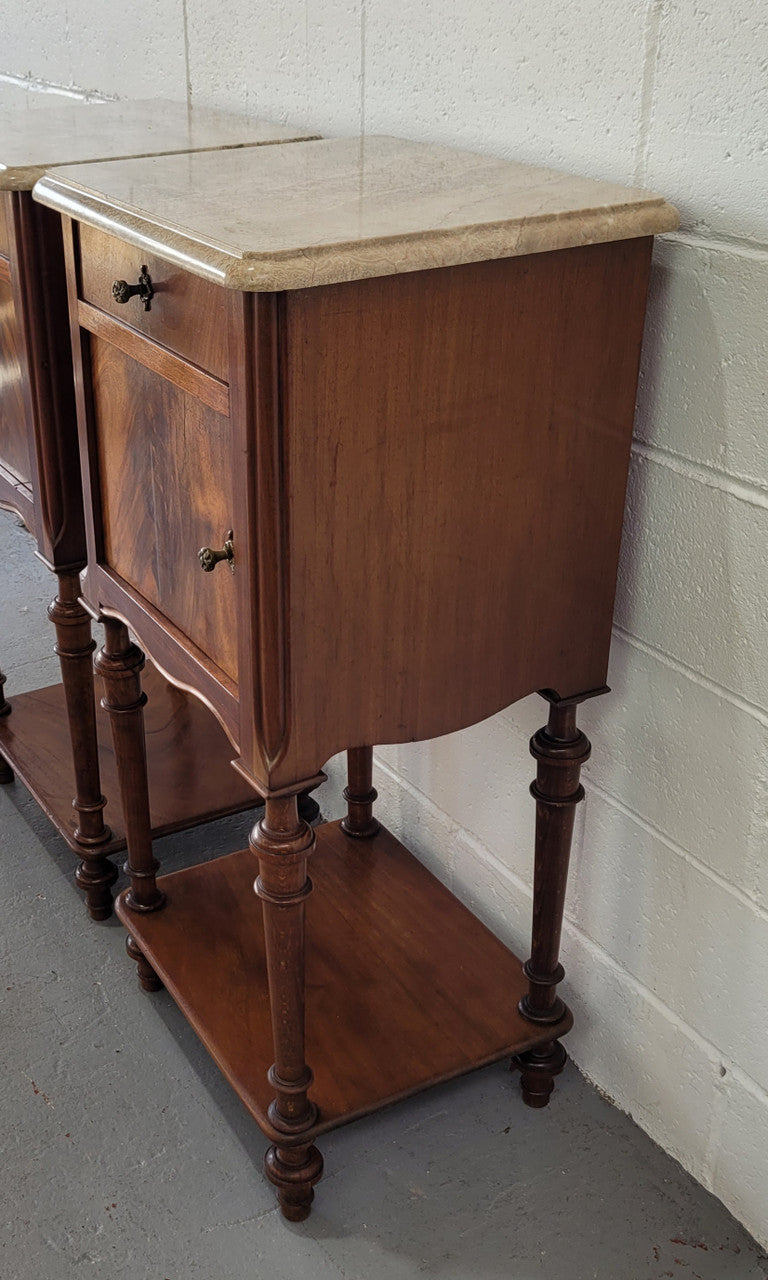 Pair of Louis XVI style walnut bedsides with attractive marble. They have one drawer, one cupboard and are in good original detailed condition.
