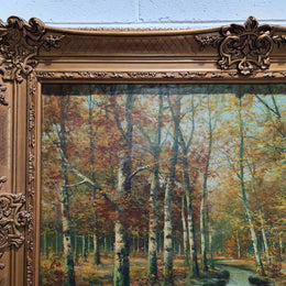 Large French signed oil on canvas painting of Autumn trees on stream scene. In a ornate gilt frame and is in good original condition.