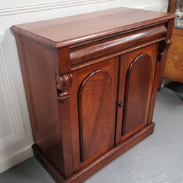 Cedar side cabinet with two doors one drawer and lovely door panels and corbels. It has been sourced locally and is in good original detailed condition.