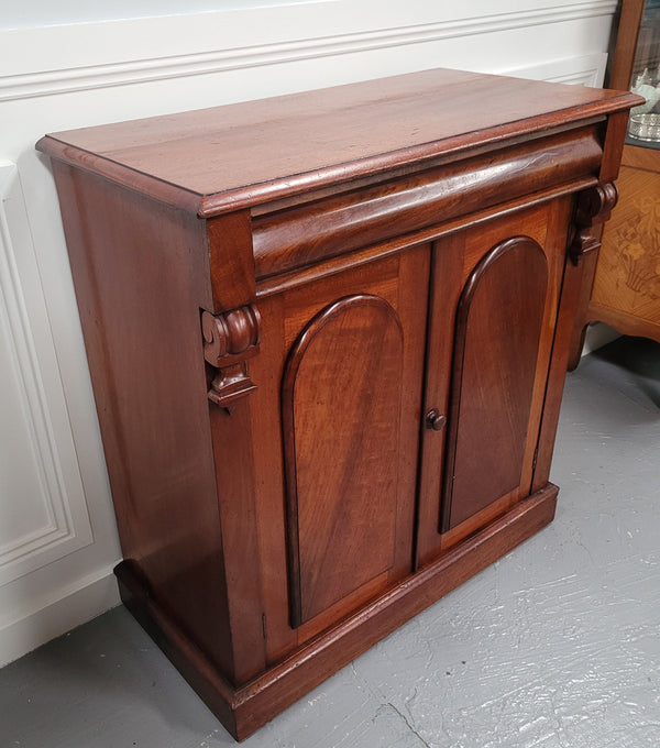 Cedar side cabinet with two doors one drawer and lovely door panels and corbels. It has been sourced locally and is in good original detailed condition.