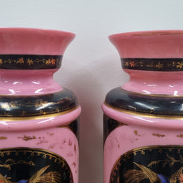 Late Victorian pink and hand painted, enameled pair of vases with some ware to enameling. It is in good original condition.