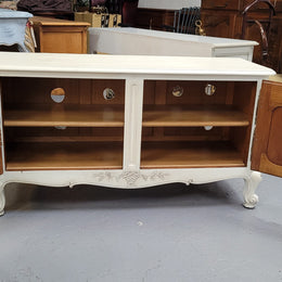 Louis XV style chalk painted two door cabinet which would also make an ideal TV cabinet. It has been sourced from France and in good original detailed condition.