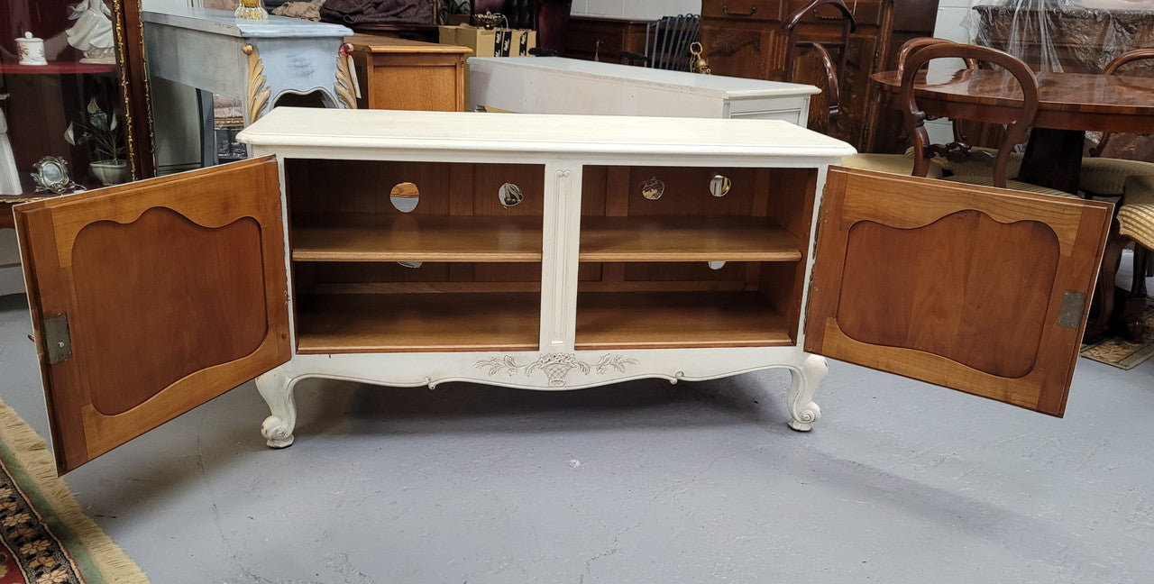 Louis XV style chalk painted two door cabinet which would also make an ideal TV cabinet. It has been sourced from France and in good original detailed condition.