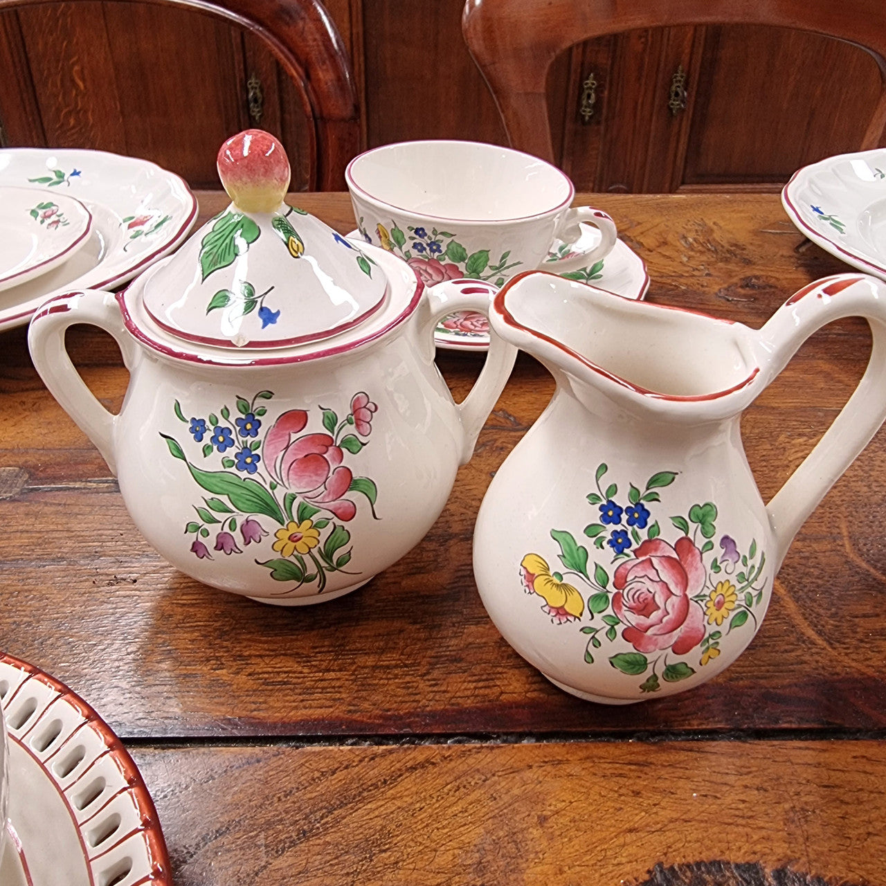 A pretty French table setting made in France called Luneville. It consists of plates, cups, saucers, tea pot, milk jug, sugar bowl, tureens and cake plates a total of 53 pieces. Please view photos as they help form part of the descriptions.