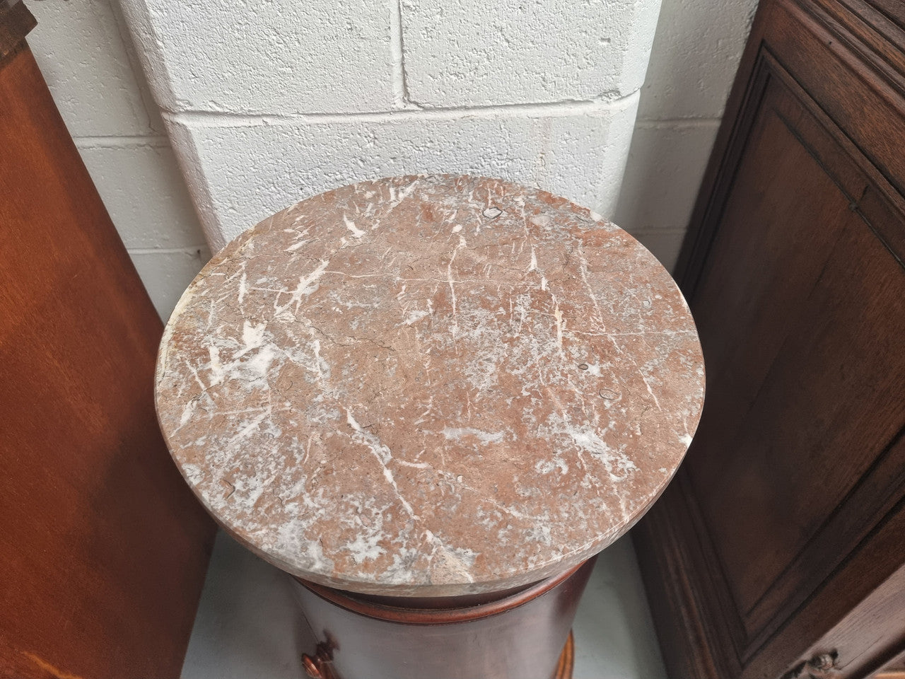 Unusual Empire flame Mahogany cylindrical marble topped bedside/pedestal. Would make an ideal pedestal with added storage inside or could be used as a bedside. Sourced from France and is in good original detailed condition.