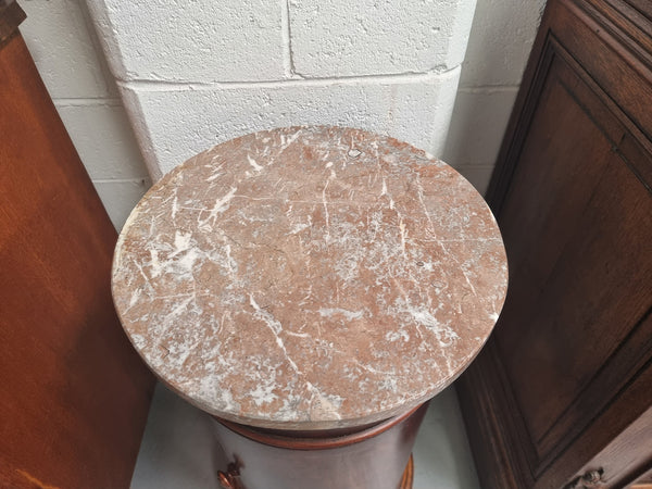 Unusual Empire flame Mahogany cylindrical marble topped bedside/pedestal. Would make an ideal pedestal with added storage inside or could be used as a bedside. Sourced from France and is in good original detailed condition.