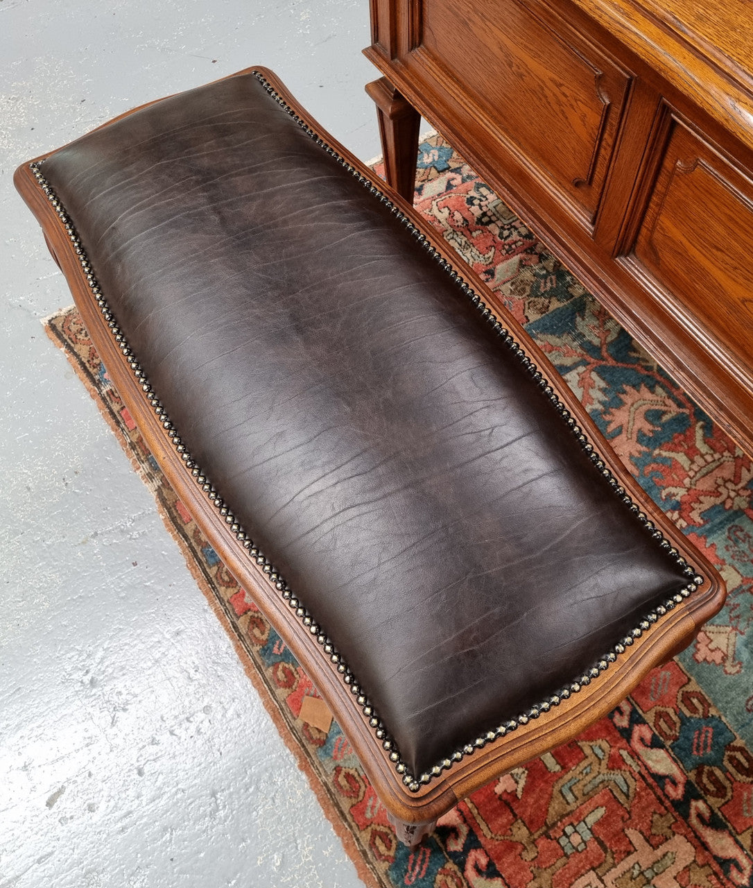 Impressive French Louis 15th style walnut upholstered duet leather stool. Very Good Condition.  Circa: 1930’s, sourced in France.