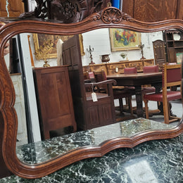 French Louis XV style carved Oak wall mirror. It is in good original detailed condition and has been sourced from France.