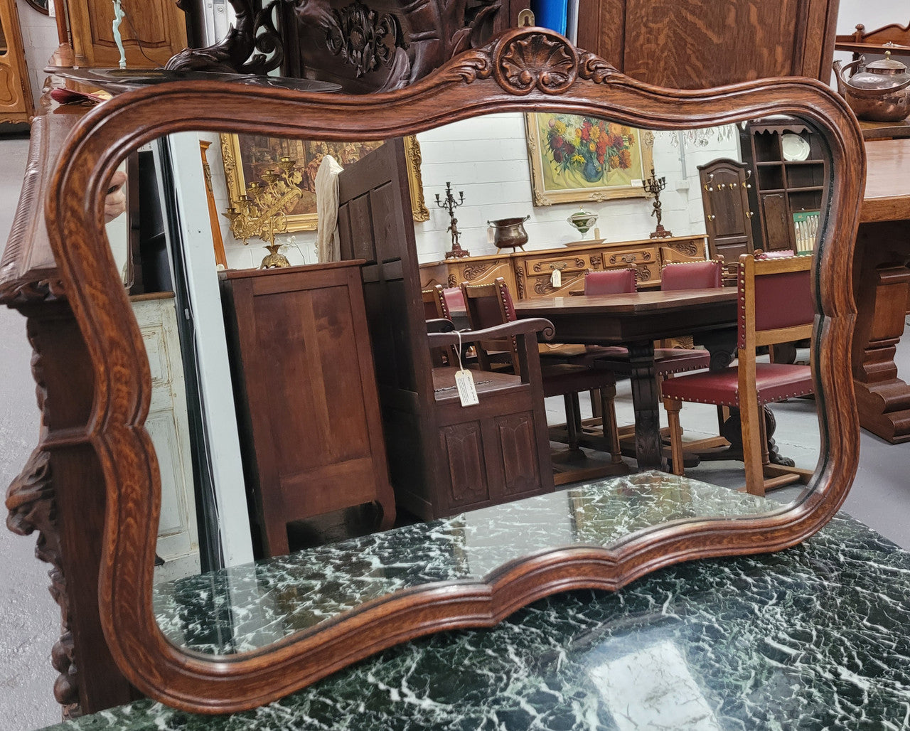 French Louis XV style carved Oak wall mirror. It is in good original detailed condition and has been sourced from France.