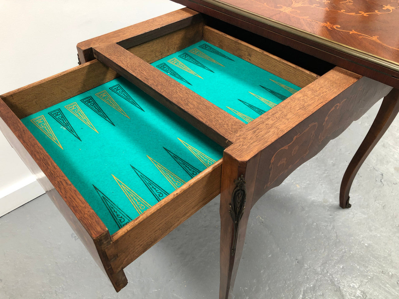 Beautiful french inlaid games table which includes internal drawers and bronze mounts. Internal drawers have counters and cards included.