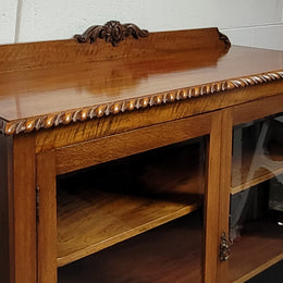 Chippendale style Mahogany two door bookcase. It has bevelled glass doors and two adjustable shelves. It has been sourced locally and is in good original detailed condition.