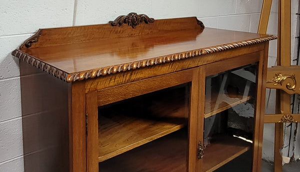 Chippendale style Mahogany two door bookcase. It has bevelled glass doors and two adjustable shelves. It has been sourced locally and is in good original detailed condition.