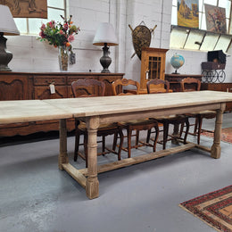 Beautilful raw solid oak French pedestal extension table. It has been sourced from France and is in good original detailed condition. When the table is fully extended it is 339 cm long and can comfortable seat 10-12 people. Features raw wood that could be used as is for a distressed look, or finished and waxed for a more refined look.