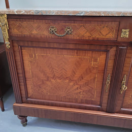 Louis 16th style Mahogany marble top cupboard and two drawers with decorative marquetry inlay and gilt bronze mounts. In good original detailed condition.