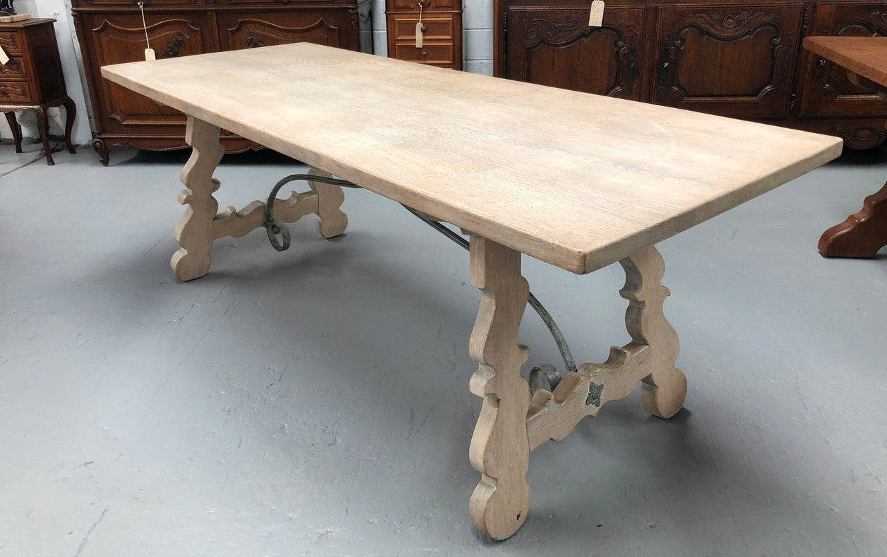 Limed French Oak Farmhouse table with decorative iron base. In good original detailed condition.
