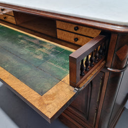 Stunning Rosewood Marble Topped Secretaire with two cupboards. Cupboards open to three fitted drawers and an additional secret drawer beneath the cupboard. All sitting on lovely carved legs and decorated with ormolu mounts. Circa: 1860. In good original detailed condition.