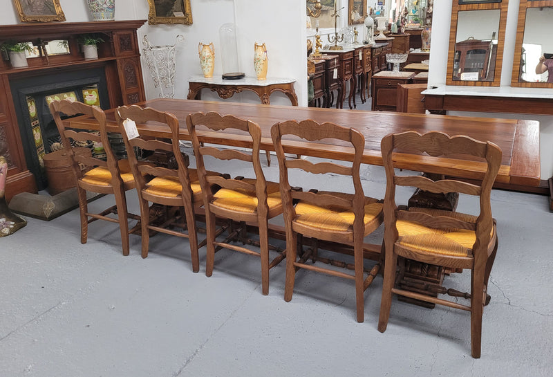 French style reclaimed Elm Farmhouse table with stretcher base and amazing carving underneath. Table can sit 10-12 people and is in good original detailed condition.