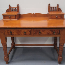 Late Victorian Huon Pine desk with two drawers. Featuring superb birdseye panels and is in good original detailed condition.