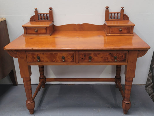 Late Victorian Huon Pine desk with two drawers. Featuring superb birdseye panels and is in good original detailed condition.