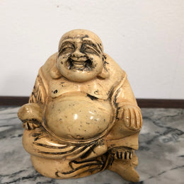 Vintage carved statue of Smiling Buddha