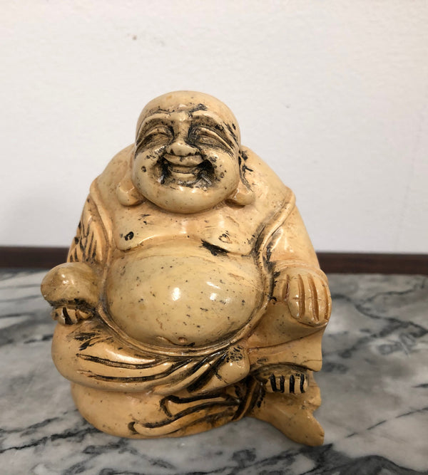 Vintage carved statue of Smiling Buddha