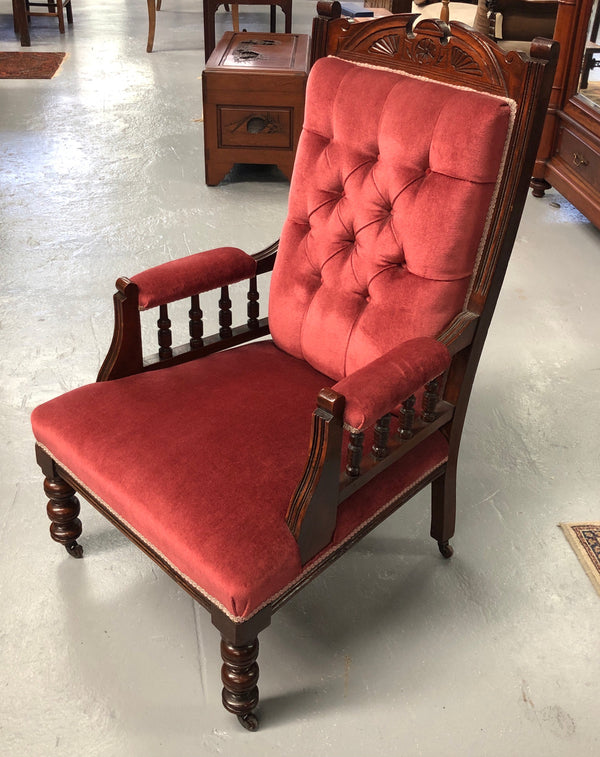 Beautiful pair of carved Edwardian arm chairs with lovely pink upholstery with button backs. In good condition.