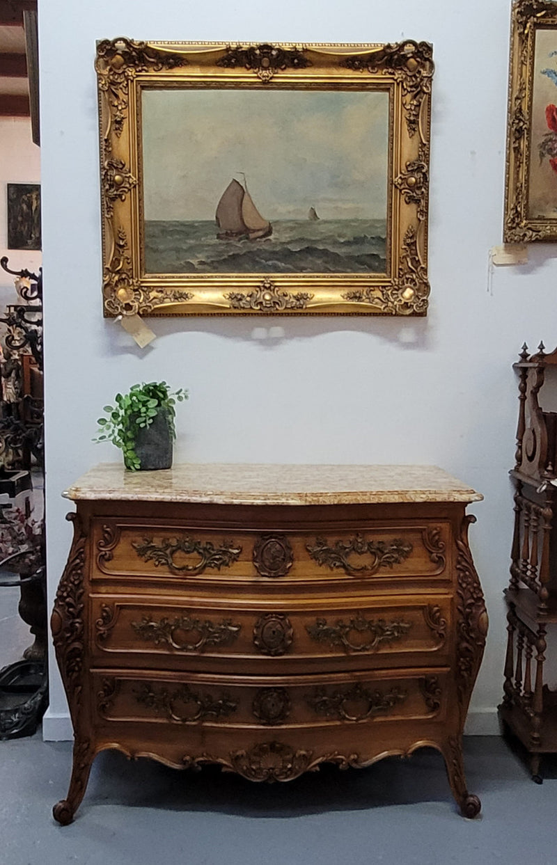 Impressive Louis XV style three drawer walnut commode. Ormolu handles and bevelled marble top complimenting detailed carving. In very good original detailed condition.