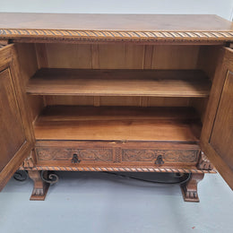 Large French Oak Renaissance style four door sideboard/buffet. Great decorative item with amazing carvings and stunning iron work on base. It is in good original detailed condition. Can pull apart completely making it easier to move.
