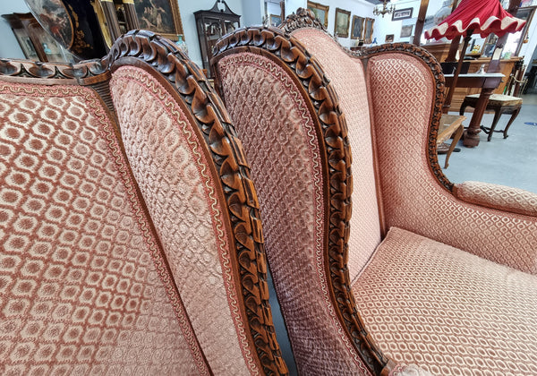 Lovely pair of  French Louis XVI style Walnut, upholstered Bergere chairs with beautiful carving and are in good original detailed condition.