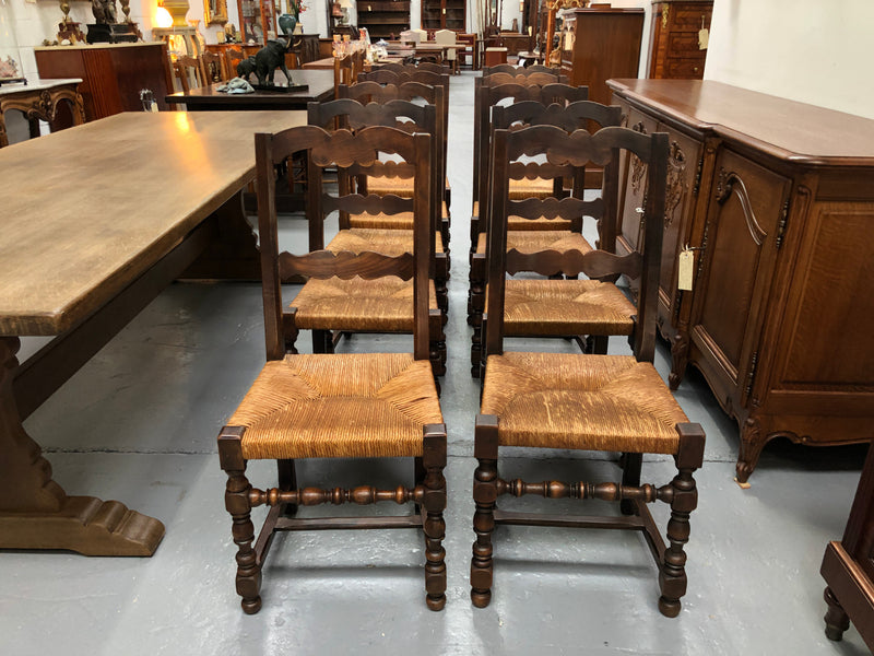 Set of 10 French Fruitwood rush seat dining chairs. They are in good original condition please view photos as they help form part of the description.