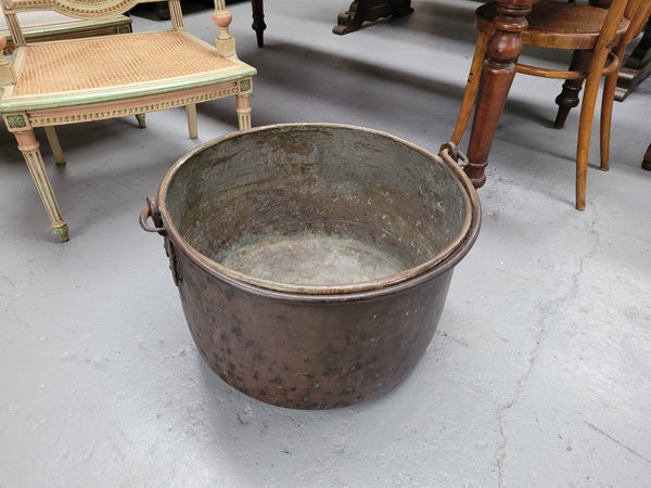 Sourced in France is this large Antique French brass firewood pot with handle. It is in original condition with some signs of wear please view photos.