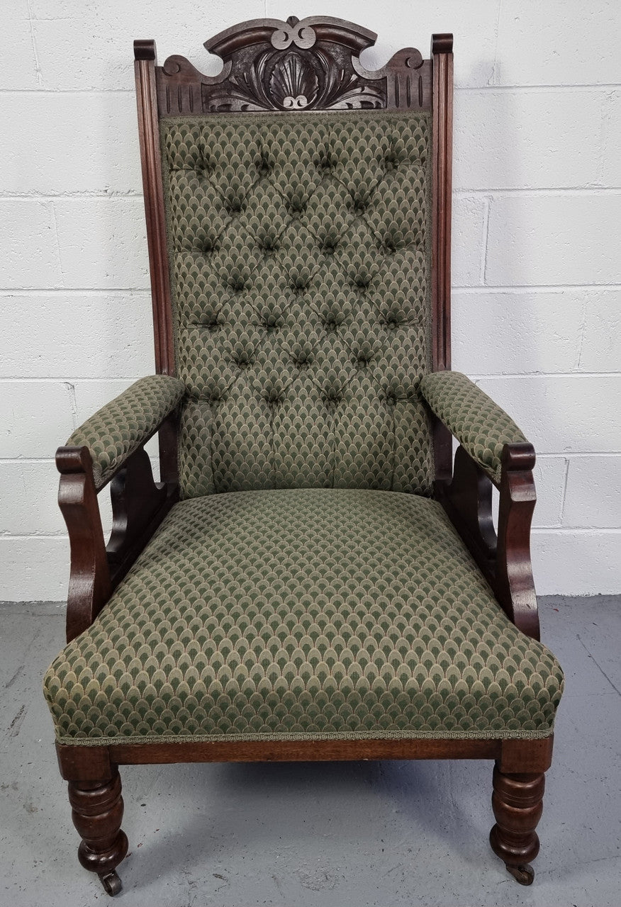 Pair of Edwardian button back Walnut armchairs. They are in good original condition with clean upholstery.