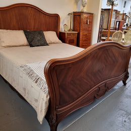 Beautiful French Walnut Louis XV style queen size bed with carving on the feet and in good original detailed condition.