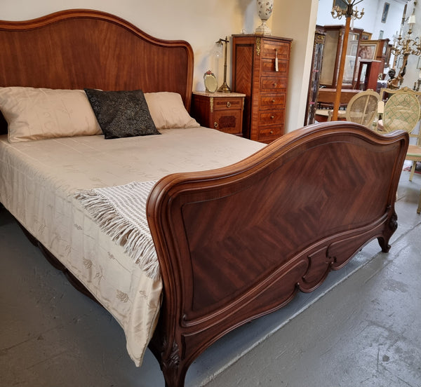 Beautiful French Walnut Louis XV style queen size bed with carving on the feet and in good original detailed condition.