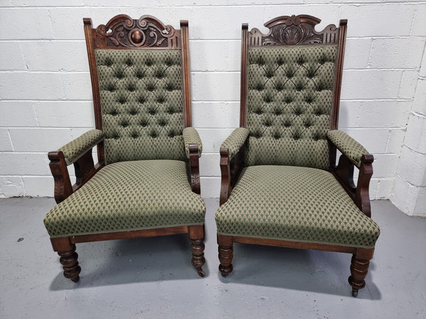 Pair of Edwardian button back Walnut armchairs. They are in good original condition with clean upholstery.