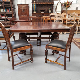 Tudor oak dining setting consisting of draw leaf extension table, 4 dining chairs and 2 carver chairs. Upholstery in excellent condition. Circa: 1930’s. The table, chair and carver chairs are in good original detailed condition.