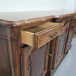 Walnut Louis XV style parquetry top four door sideboard with beautiful carving. Plenty of storage space and it is in good original detailed condition.