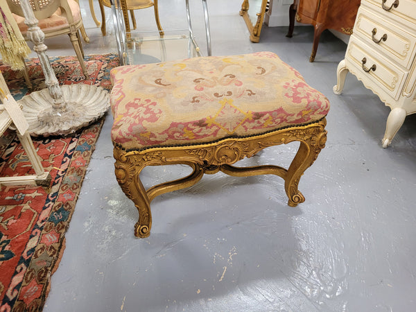 Charming 19th Century gilt wood tapestry covered Louis XV style stool. It has a beautifully carved base and undercarriage and it has been sourced from France. It is in good original detailed condition, please view photos of tapestry has they help form part of the description.