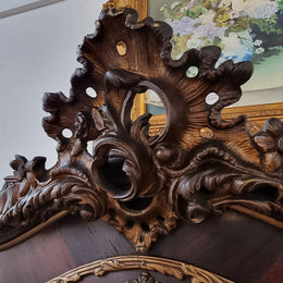 French Louis XV style marquetry inlaid vitrine with ormolu mounts and curved glass. The inside in lined with a red velvet upholstery and has two glass shelves. It has been sourced from France and is in good original detailed condition.