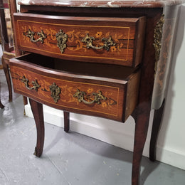 A stunning French petite two drawer inlaid Rosewood commode. In good original detailed condition.