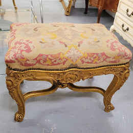 Charming 19th Century gilt wood tapestry covered Louis XV style stool. It has a beautifully carved base and undercarriage and it has been sourced from France. It is in good original detailed condition, please view photos of tapestry has they help form part of the description.