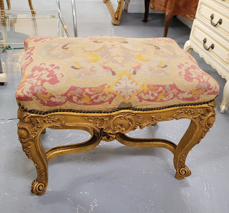 Charming 19th Century gilt wood tapestry covered Louis XV style stool. It has a beautifully carved base and undercarriage and it has been sourced from France. It is in good original detailed condition, please view photos of tapestry has they help form part of the description.