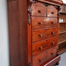 A 19th Century Scottish Flame Mahogany tall boy/ Chest of six drawers. Beautiful carvings and easily comes apart into three sections making transport o0r moving into place easy. In good original detailed condition.