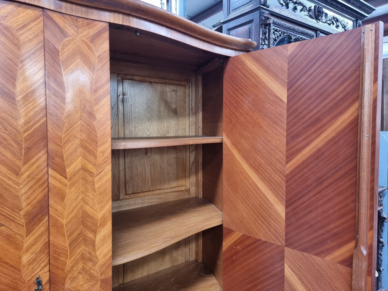 Charming French Louis XV Style Marquetry Inlaid Two Door Armoire. Features three adjustable shelves and ormolu trim. It has been sourced from France and is in good original condition.