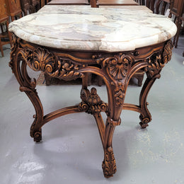 French Walnut Louis XV style round marble top centre table. It has amazing eye-catching marble, ornate detailed carvings and a beautifully carved undercarriage. In good original detailed condition.